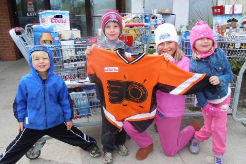 Young supporters of the Frontenac Minor Hockey Association, whose siblings play on the new novice rep team- l-r, Owen, Joshua, Julianna and Violet  